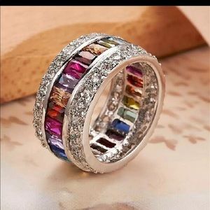 One Love thumb ring: Multicolored infinity band with white zirconia bagu…
